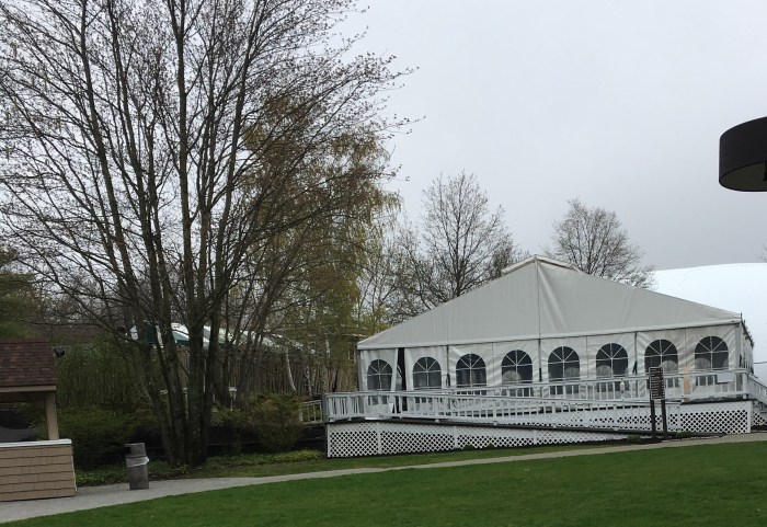 A large white structure that served as the dog play pavilion at the Guiding Eyes seminar