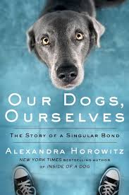 the cover of Our Dogs, Ourselves by Alexandra Horowitz shows a dog peering up at a person