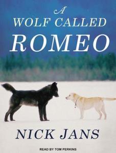 Book cover showing large black wolf nose to nose with a yellow Labrador